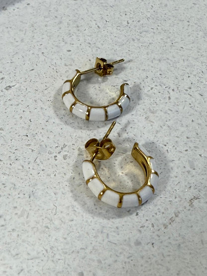 White hoops with gold stripes