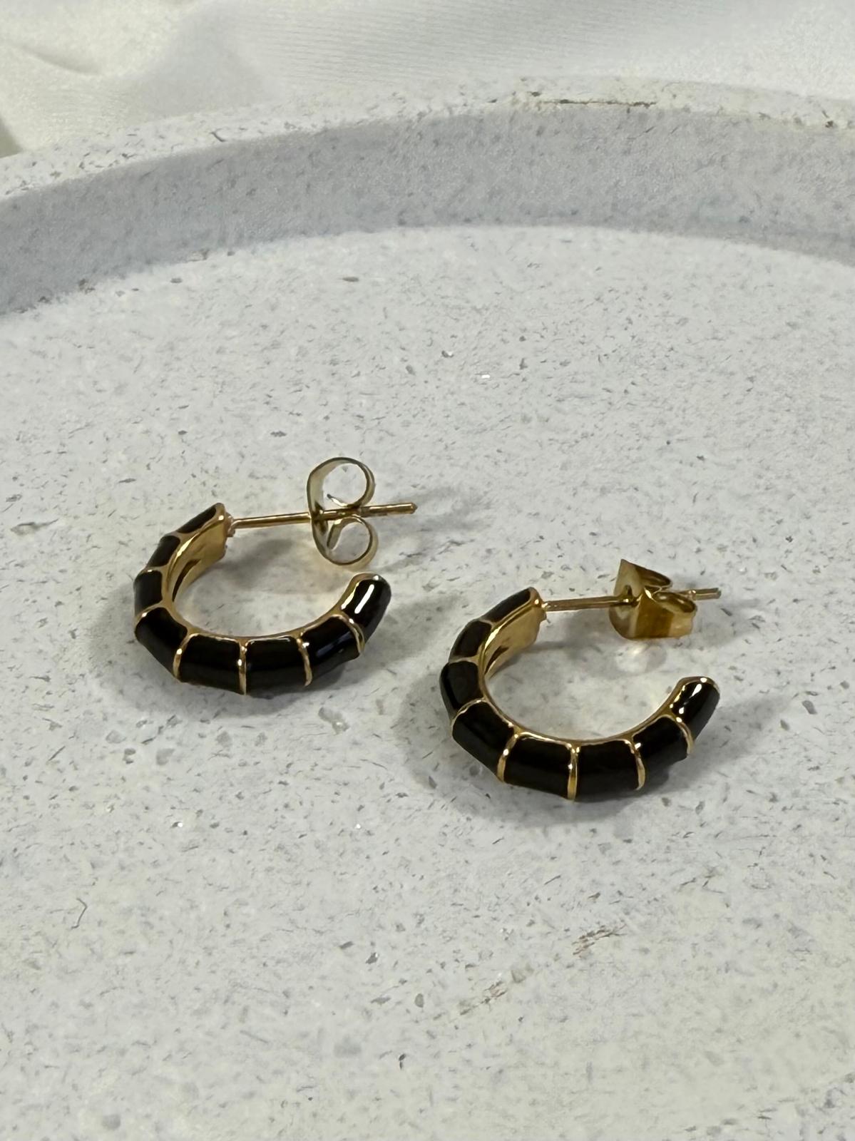 Black hoops with gold stripes