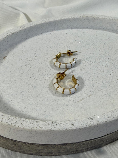 White hoops with gold stripes